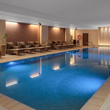 Doubletree By Hilton La Torre Golf Resort Roldan Bagian luar foto The swimming pool at the hotel