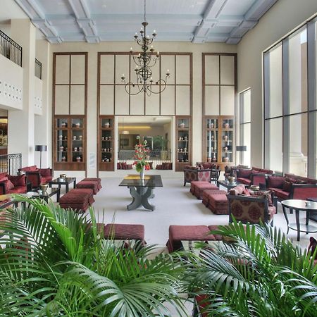 Doubletree By Hilton La Torre Golf Resort Roldan Bagian luar foto The lobby of the hotel