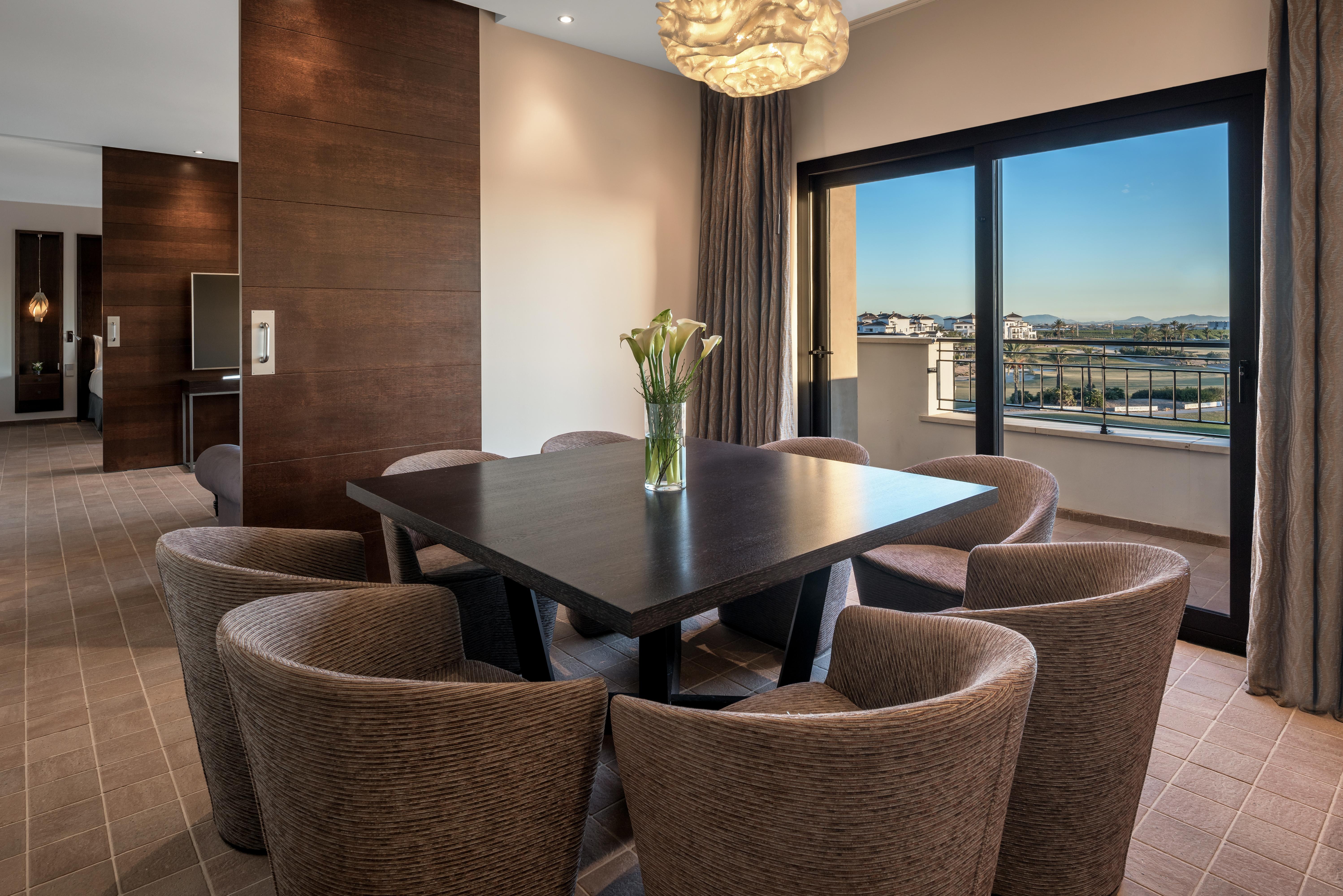 Doubletree By Hilton La Torre Golf Resort Roldan Bagian luar foto A suite at the Hilton Athens