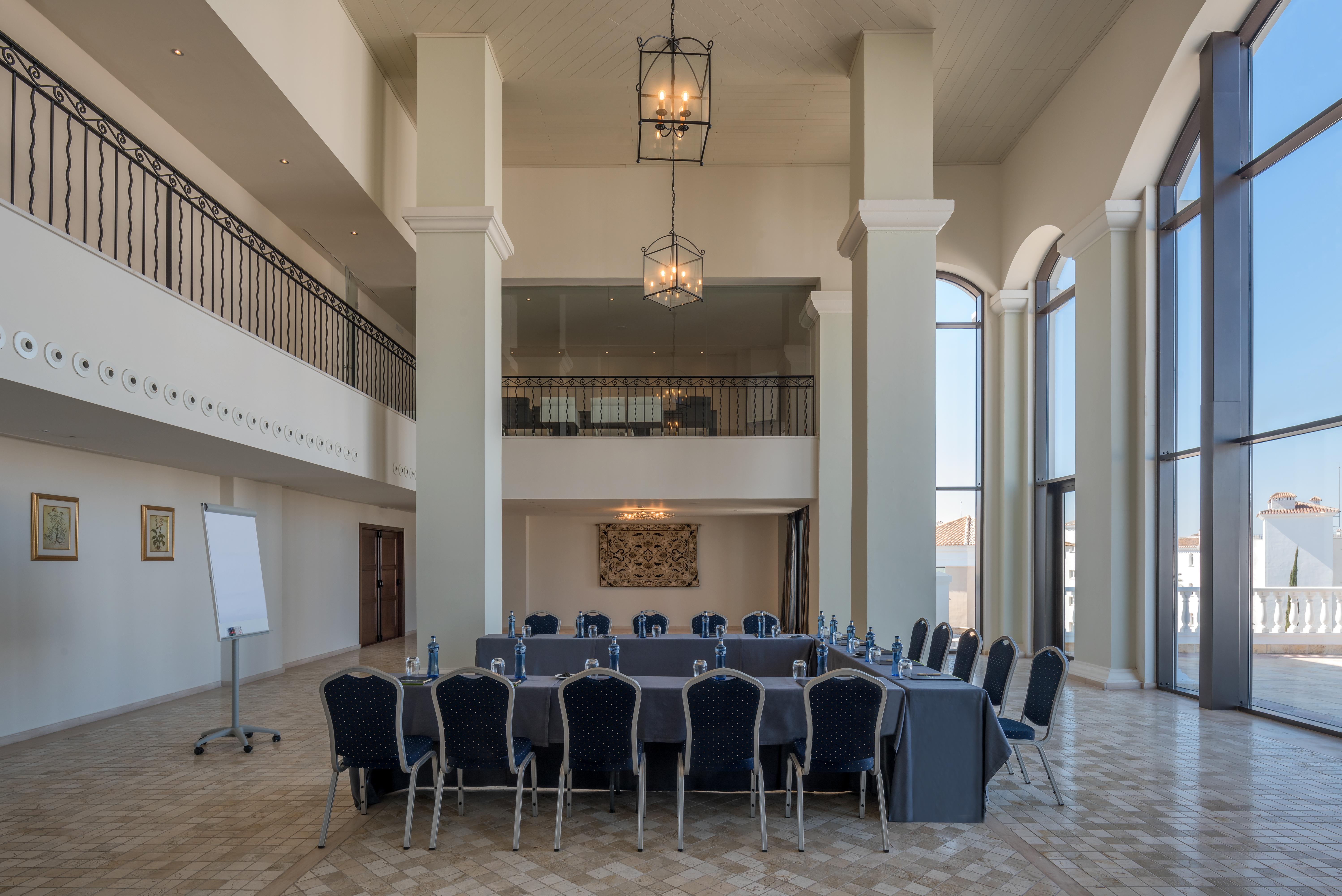 Doubletree By Hilton La Torre Golf Resort Roldan Bagian luar foto The interior of the conference hall