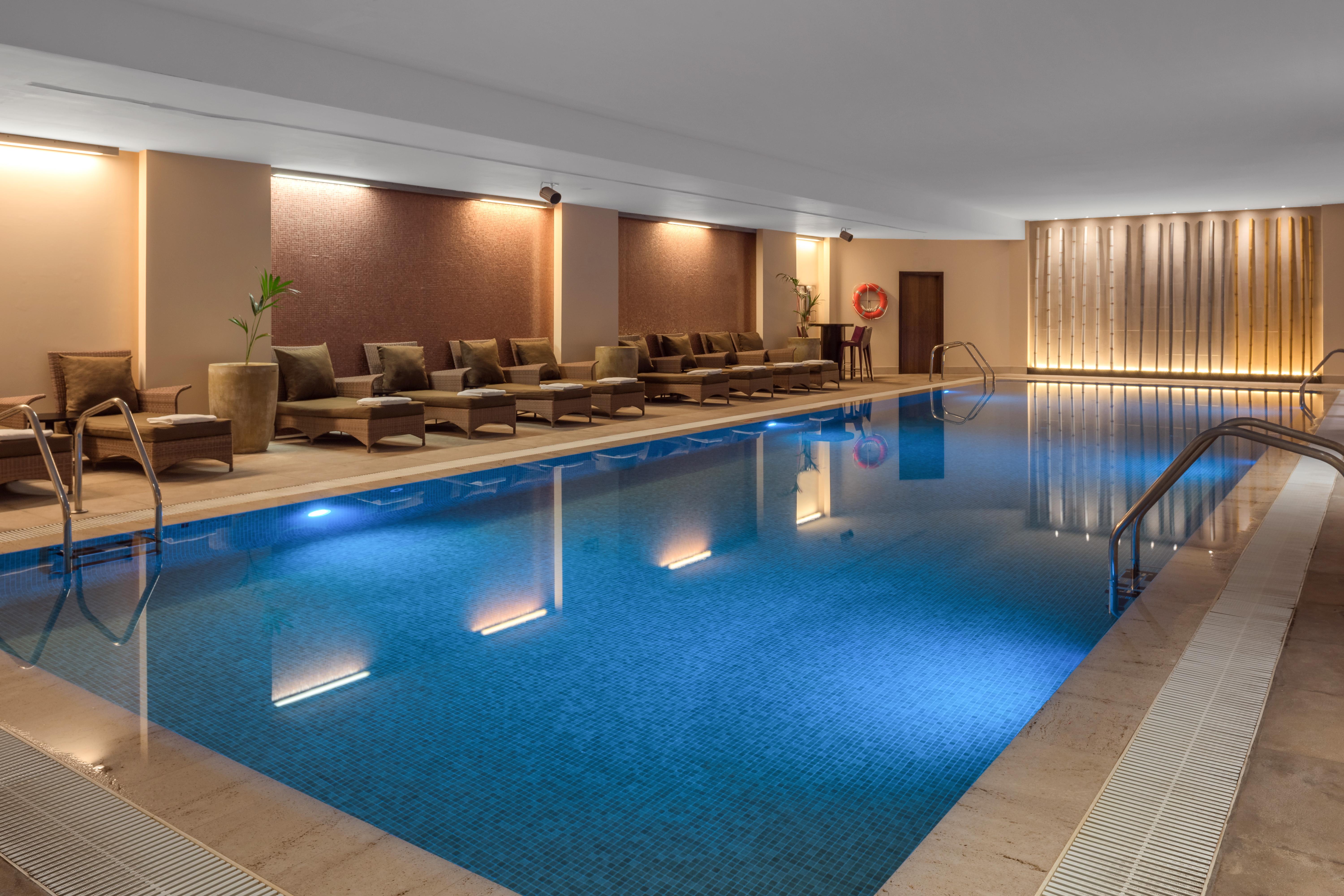 Doubletree By Hilton La Torre Golf Resort Roldan Bagian luar foto The swimming pool at the hotel