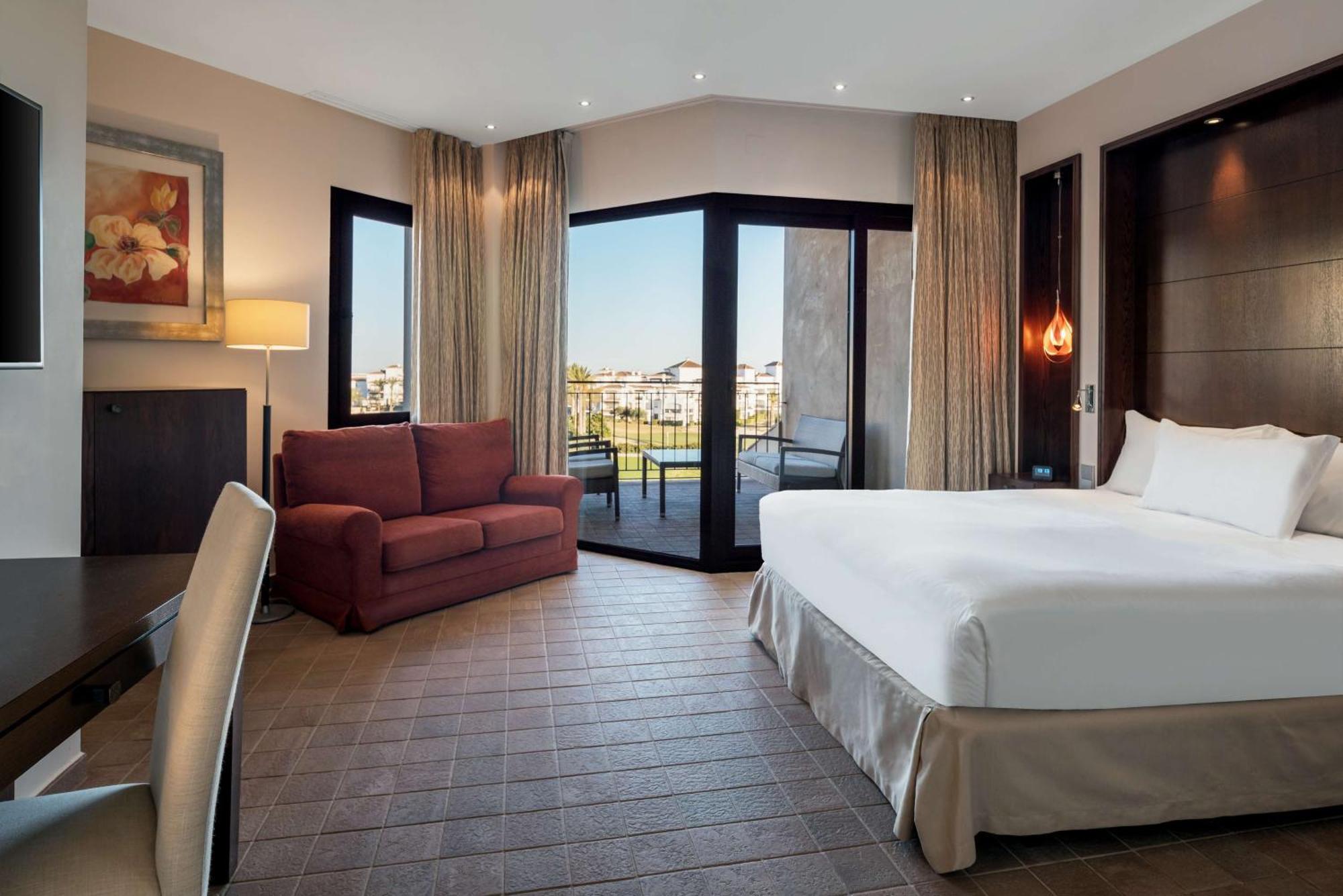 Doubletree By Hilton La Torre Golf Resort Roldan Bagian luar foto A room at the hotel