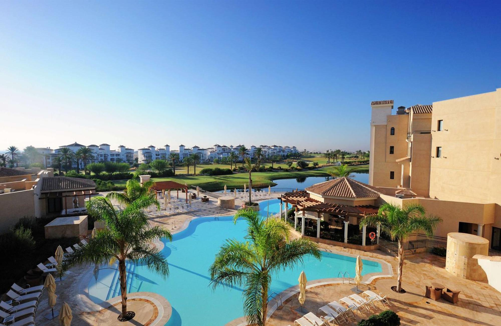 Doubletree By Hilton La Torre Golf Resort Roldan Bagian luar foto View of the pool at the clubhouse