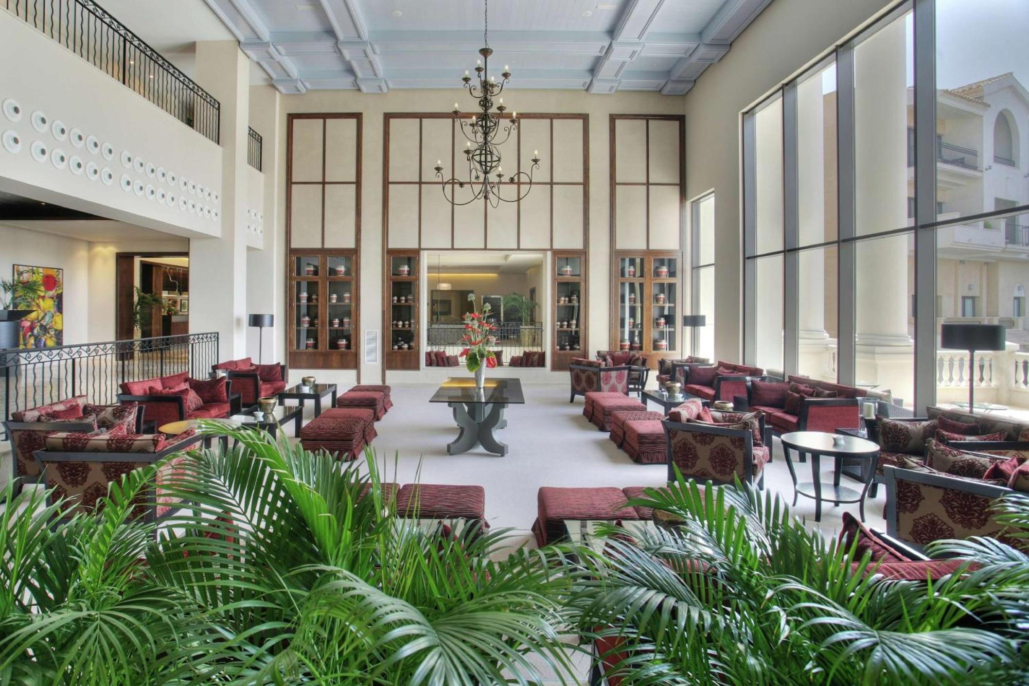 Doubletree By Hilton La Torre Golf Resort Roldan Bagian luar foto The lobby of the hotel