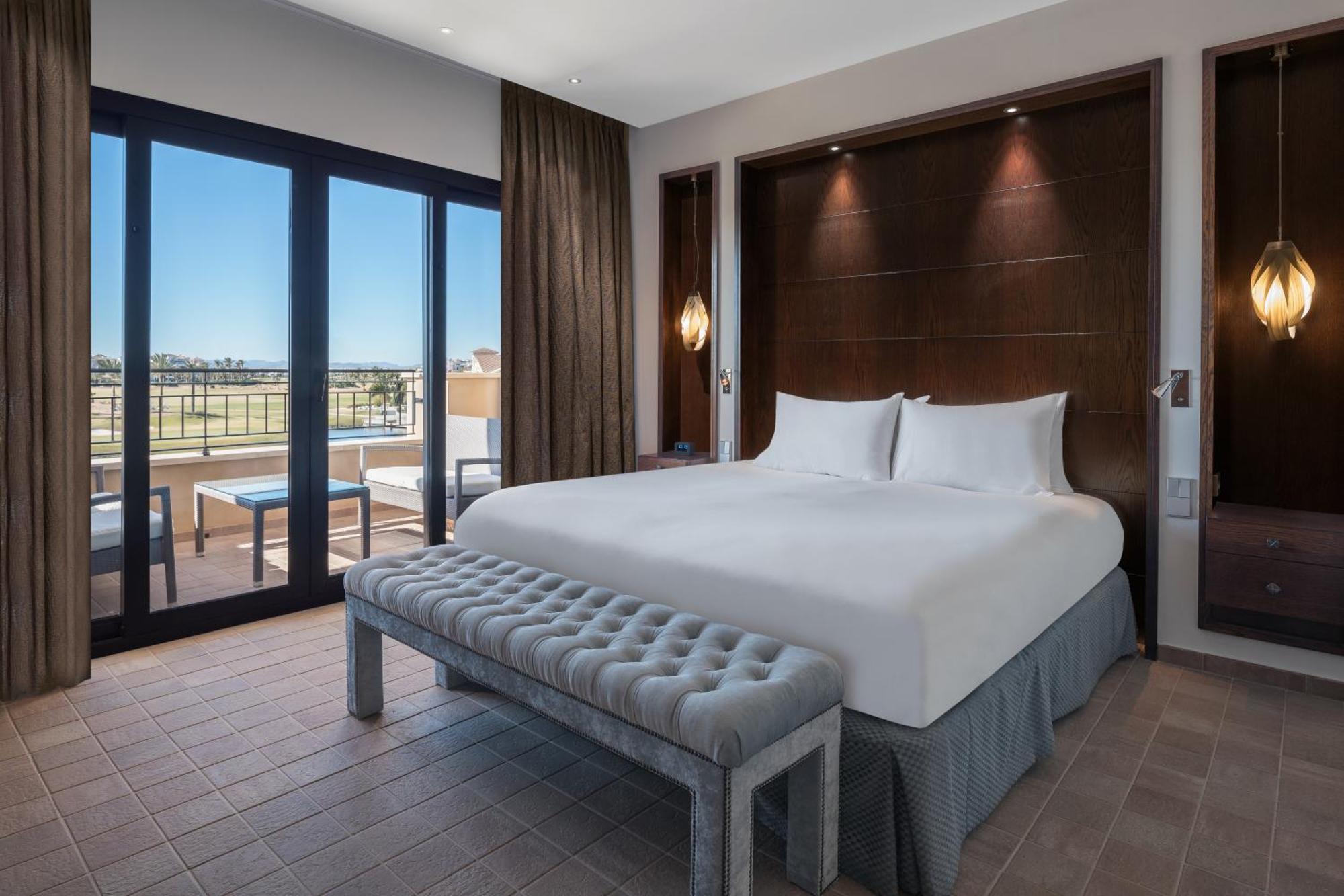 Doubletree By Hilton La Torre Golf Resort Roldan Bagian luar foto A bedroom at the hotel