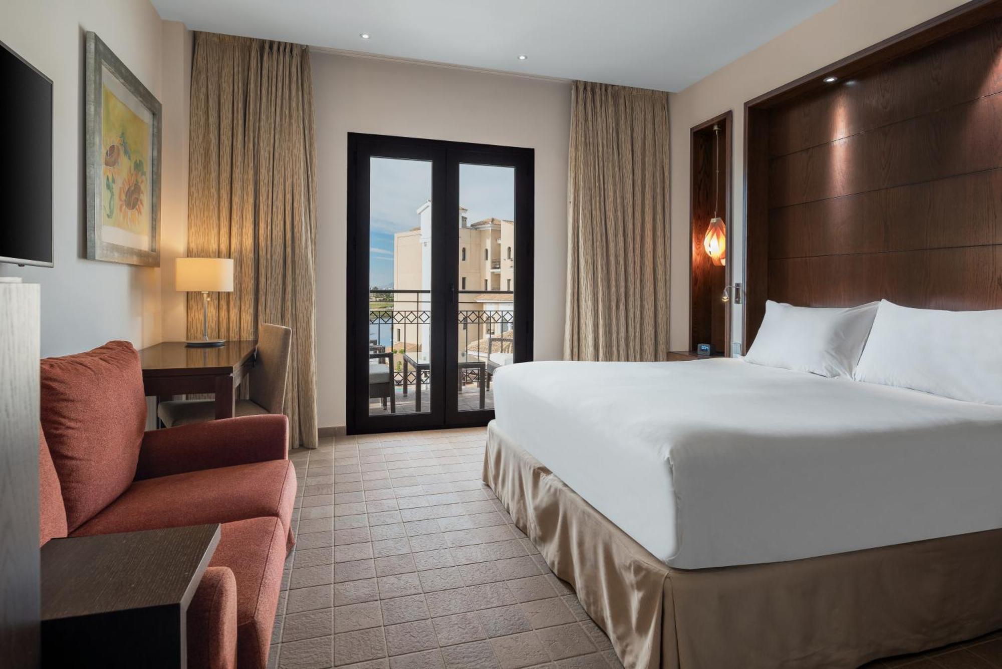 Doubletree By Hilton La Torre Golf Resort Roldan Bagian luar foto A room at the Hilton Nicosia