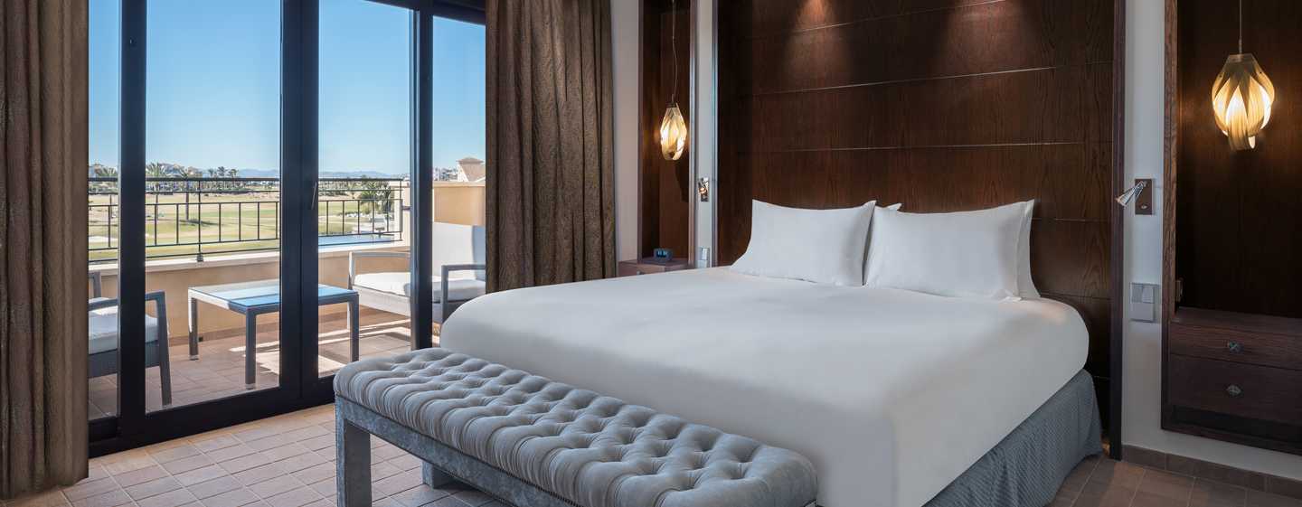 Doubletree By Hilton La Torre Golf Resort Roldan Bagian luar foto A bedroom at the hotel