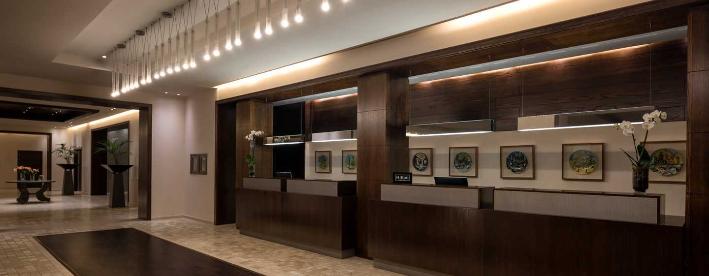 Doubletree By Hilton La Torre Golf Resort Roldan Bagian luar foto The lobby of the hotel