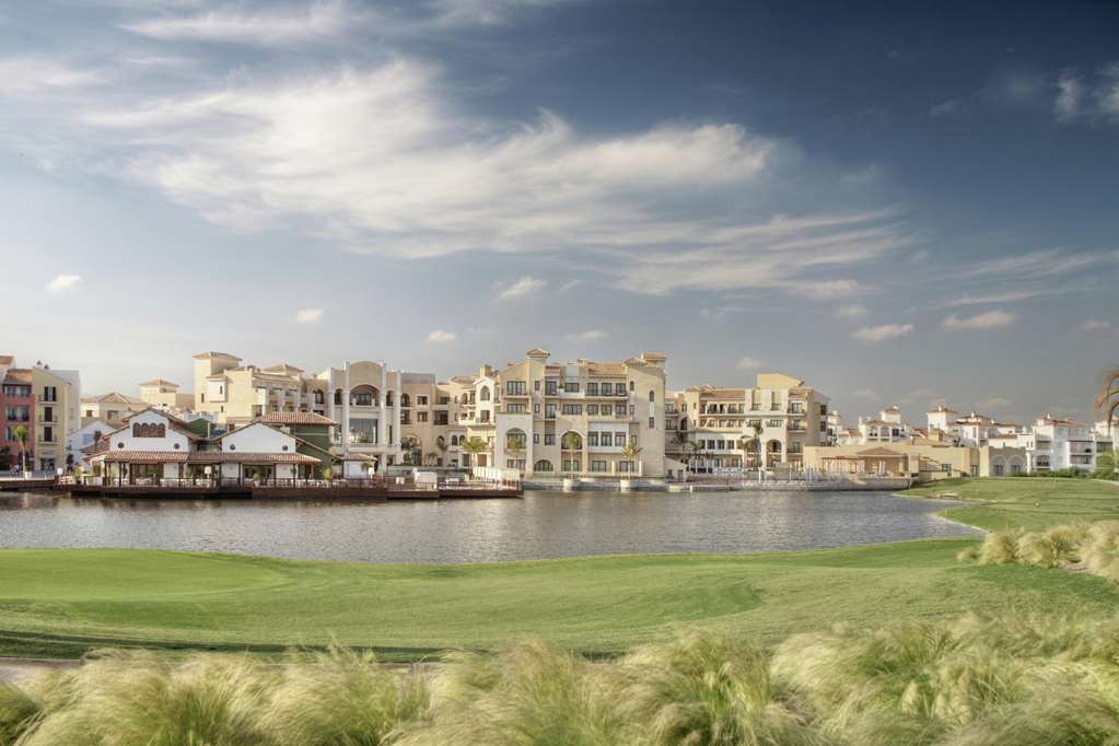 Doubletree By Hilton La Torre Golf Resort Roldan Bagian luar foto View of the community